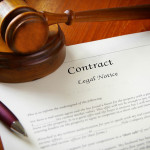 legal gavel and a business contract